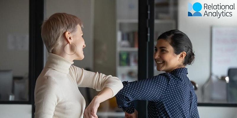 Two people bumping elbows in greeting